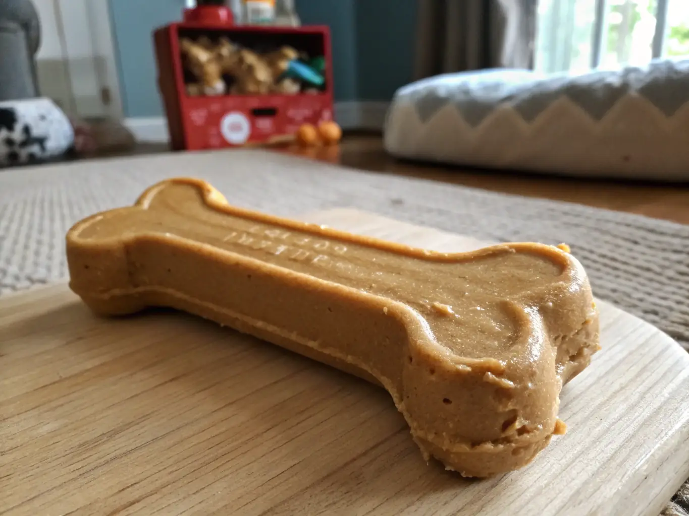 An appealing image of a peanut butter-flavored dog bone, emphasizing its smooth texture and rich color, displayed in a pet-friendly setting.